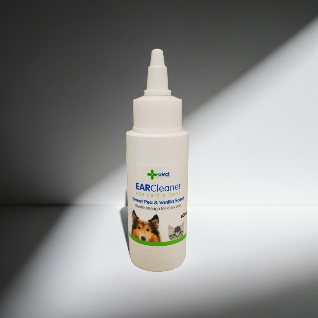 Bottle of ear cleaner for pets on a gray background