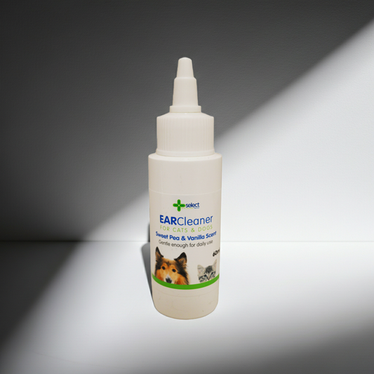 Bottle of ear cleaner for pets on a gray background